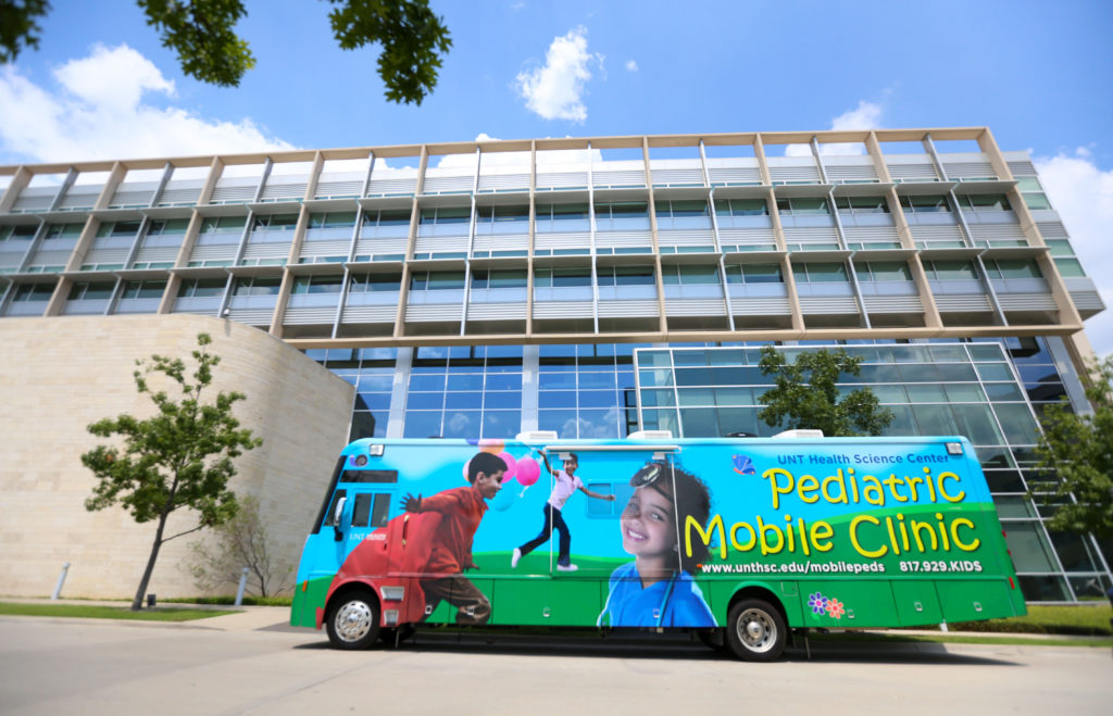Pediatric Mobile Unit bus parked on the campus of UNT Health