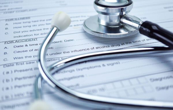Stethoscope on insurance documents