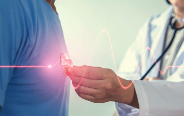 Doctor listening to patient's heartbeat